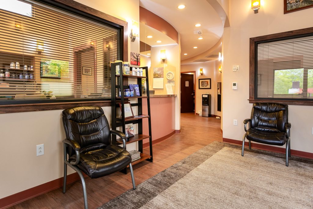 Comfortable patient waiting room and check-in desk at River Ridge Chiropractic & Acupuncture in Asheville, NC.